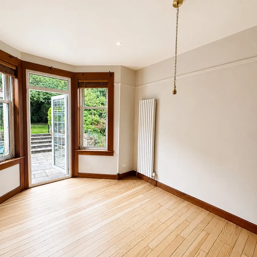 Freshly painted room with bay window and garden doors, Edinburgh