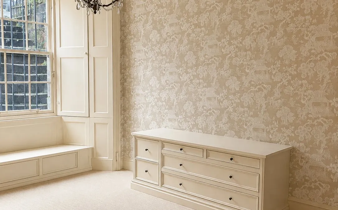 Redecorated bedroom with feature wallpaper and chandelier, Edinburgh period property