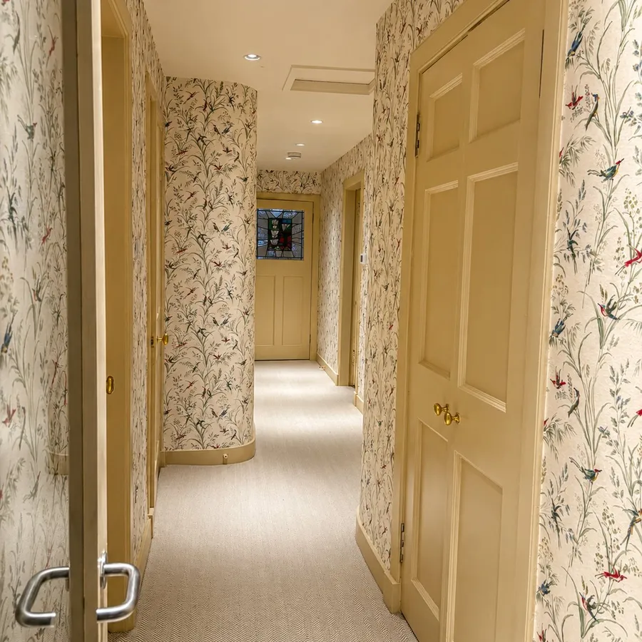 Hallway with feature bird and botanical wallpaper, Stockbridge, Edinburgh