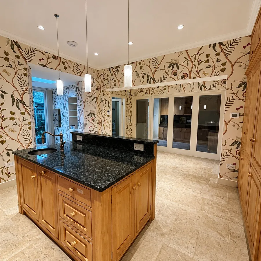 Kitchen with floral feature wallpaper and oak island, Stockbridge, Edinburgh