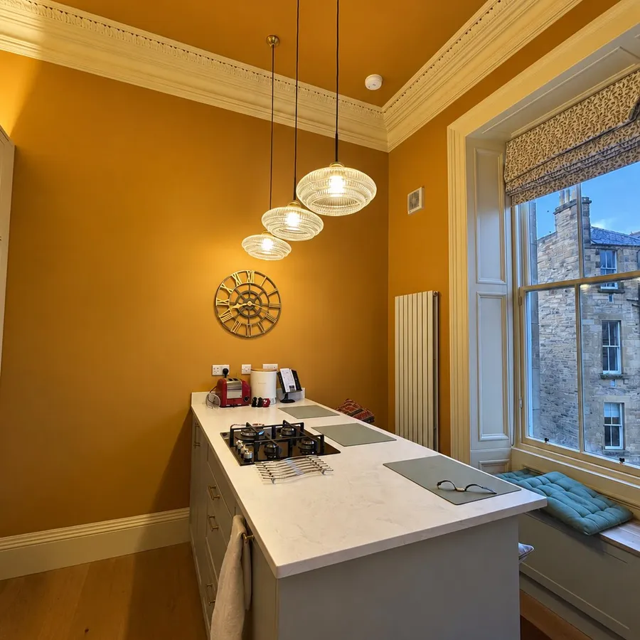 Mustard yellow kitchen repaint with window seat, Stockbridge, Edinburgh