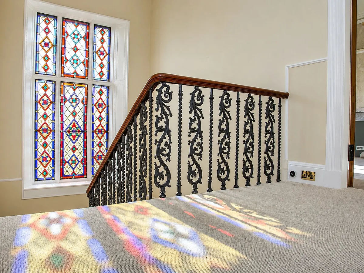 Repainted staircase with original stained glass window, The Grange, Edinburgh
