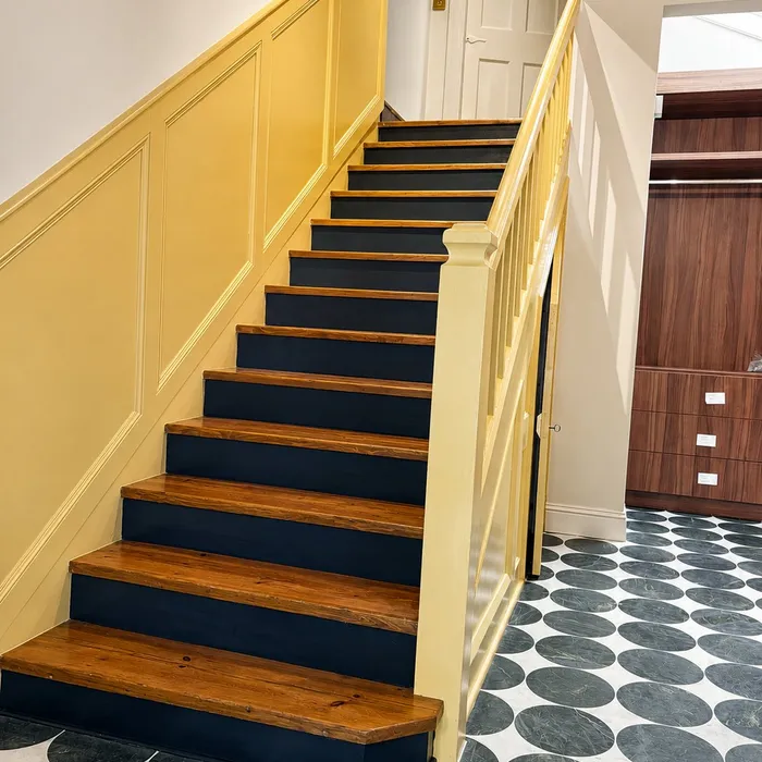 Repainted staircase with yellow panelling and navy treads, Inverleith, Edinburgh
